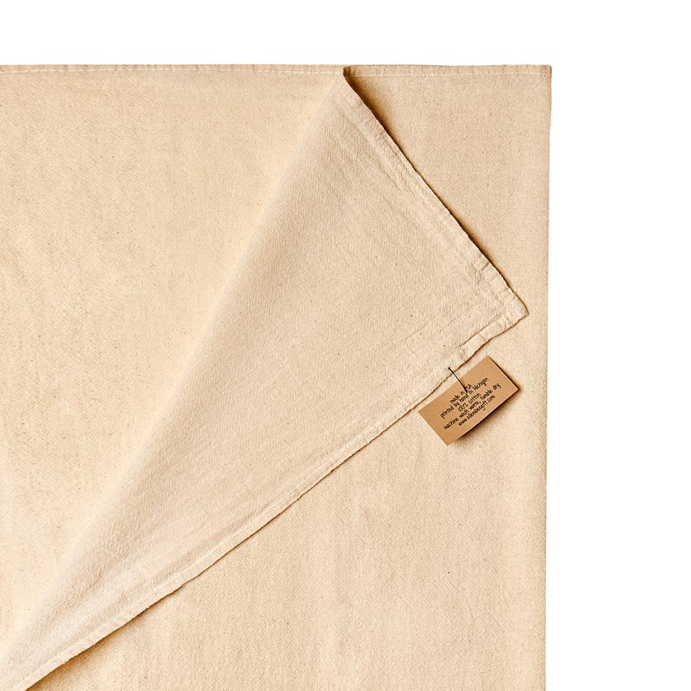 Beige fabric with a brand label on a white background