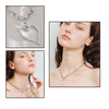 Heart-shaped silver necklace on a white background with close-up shots of a woman wearing it.
