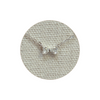 Silver necklace with a diamond bow pendant on a textured gray background
