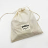 Beige drawstring bag with 'pebble story sack' label on a white background
