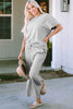 Experience ultimate comfort with this Gray Textured Loose Fit T Shirt and Drawstring Pants Set in sizes S-2XL. The stylish textured fabric adds a touch of flair while the drawstring waist allows for a customizable fit. This set is perfect for a casual and relaxed look that will leave you feeling comfortable and stylish.