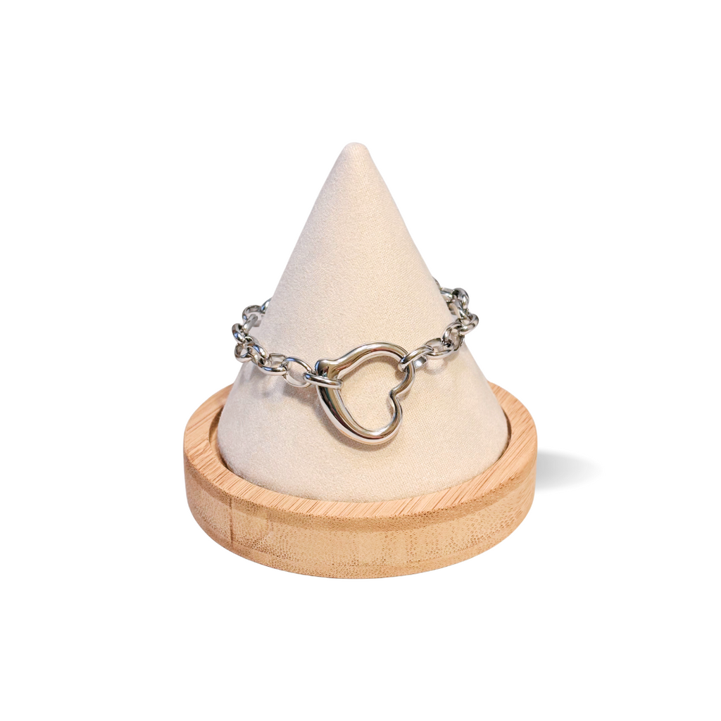 Chunky platinum belcher chain bracelet with puffy heart charm – stainless steel waterproof jewelry on display cone