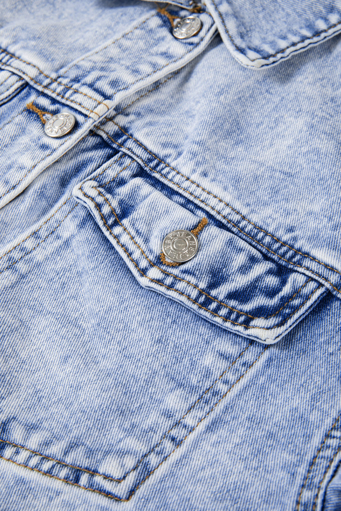 This vintage and stylish jean jacket makes a statement with its classic wash and practical features. It's perfect for layering over any t-shirt or tank.