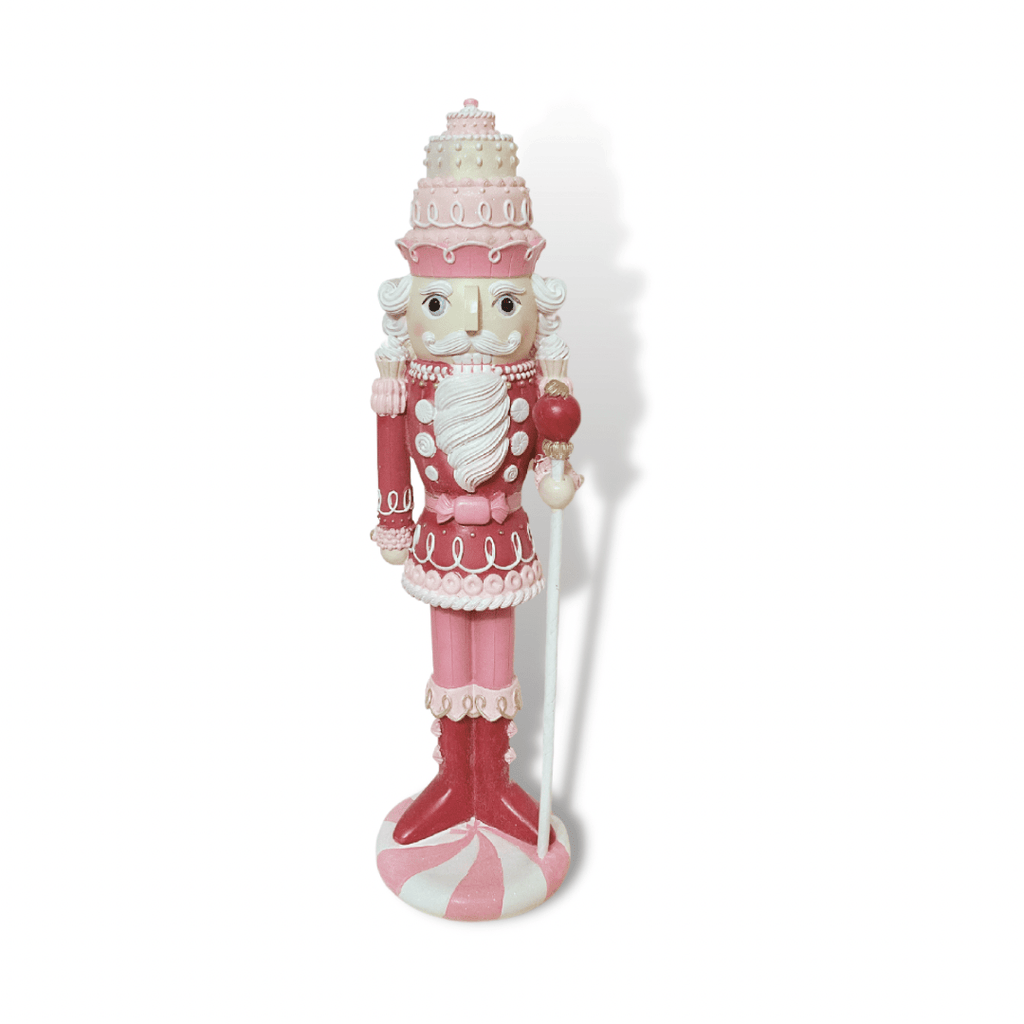 December Diamonds exquisitely crafted nutcracker stands at 21.5" tall, an elegant addition to your festive or sweets décor. Also available in teal.  Total Size: 6"L 21.5"H x 5.5"W | Resin